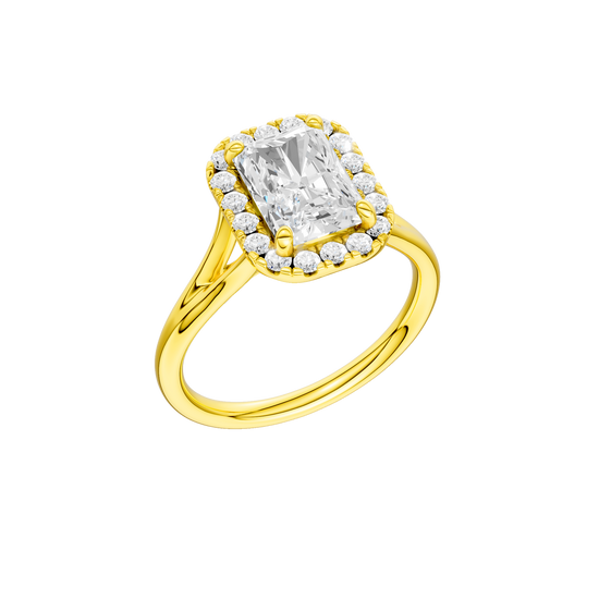 A three-quarter view of the Radiant cut diamond engagement ring in 14k yellow gold with a plain band and halo setting