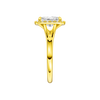 A side view of the Radiant cut diamond engagement ring in 14k yellow gold with a plain band and halo setting
