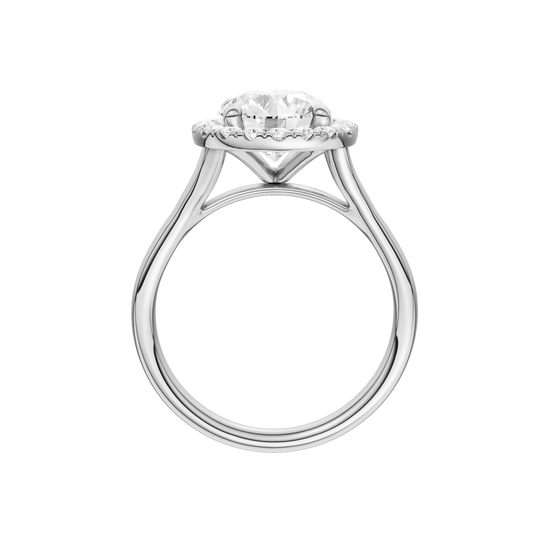 A profile view of the Round cut diamond engagement ring in 14k white gold with a plain band and halo setting