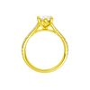 A profile view of the Marquise cut diamond engagement ring in 14k yellow gold with a prong band and solitaire setting