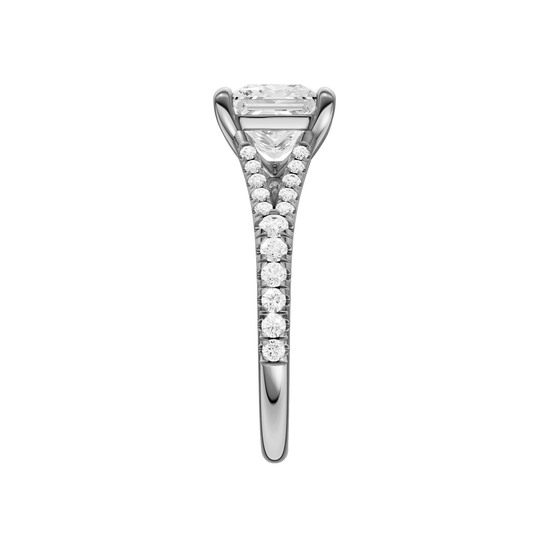 A side view of the Emerald cut diamond engagement ring in 14k white gold with a prong band and solitaire setting
