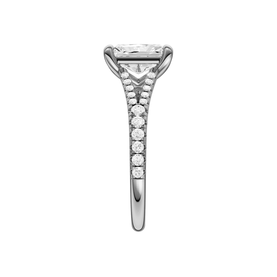 A side view of the Radiant cut diamond engagement ring in 14k white gold with a diamond band and solitaire setting