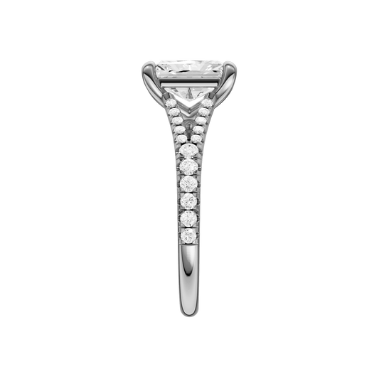 A side view of the Radiant cut diamond engagement ring in 14k white gold with a diamond band and solitaire setting