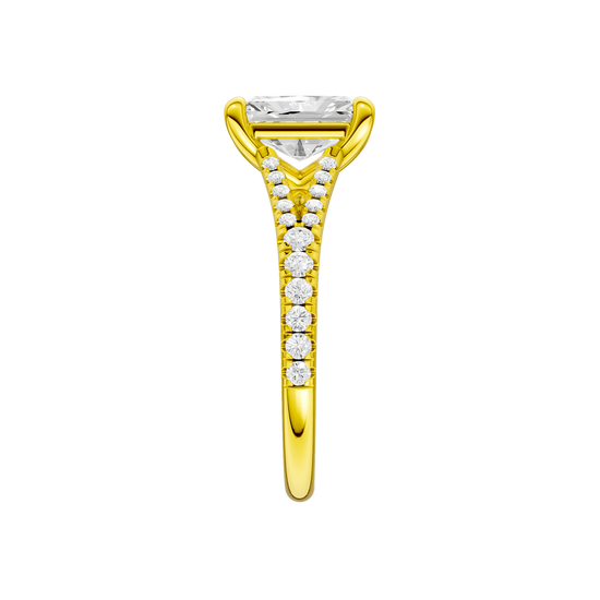 A side view of the Radiant cut diamond engagement ring in 14k yellow gold with a diamond band and solitaire setting