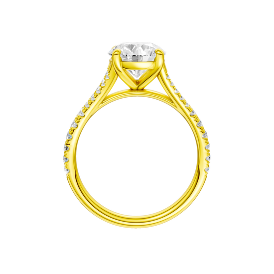 A profile view of the Round cut diamond engagement ring in 14k yellow gold with a diamond band and solitaire setting