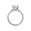 A profile view of the Elongated Cushion cut diamond engagement ring in 14k white gold with a diamond band and hidden halo setting