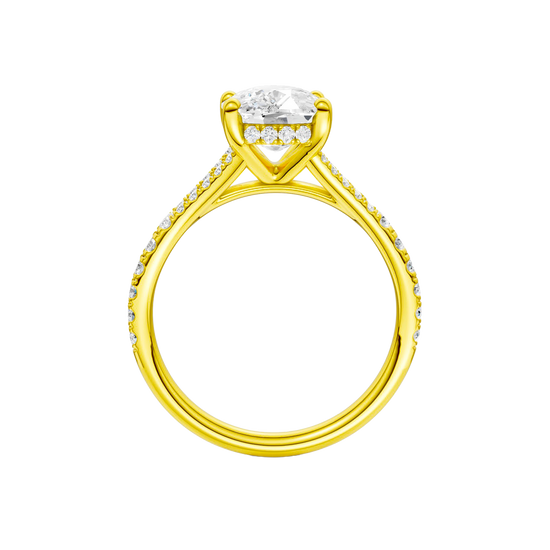 A profile view of the Elongated Cushion cut diamond engagement ring in 14k yellow gold with a diamond band and hidden halo setting