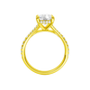 A profile view of the Elongated Cushion cut diamond engagement ring in 14k yellow gold with a diamond band and hidden halo setting