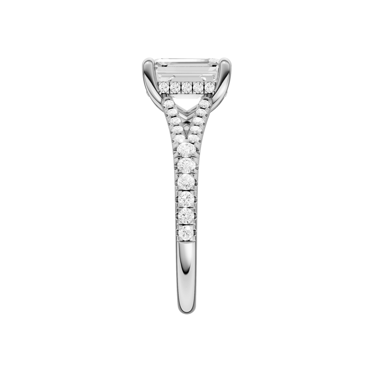 A side view of the Emerald cut diamond engagement ring in 14k white gold with a prong diamond band and hidden halo setting