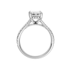 A profile view of the Emerald cut diamond engagement ring in platinum with a prong diamond band and hidden halo setting