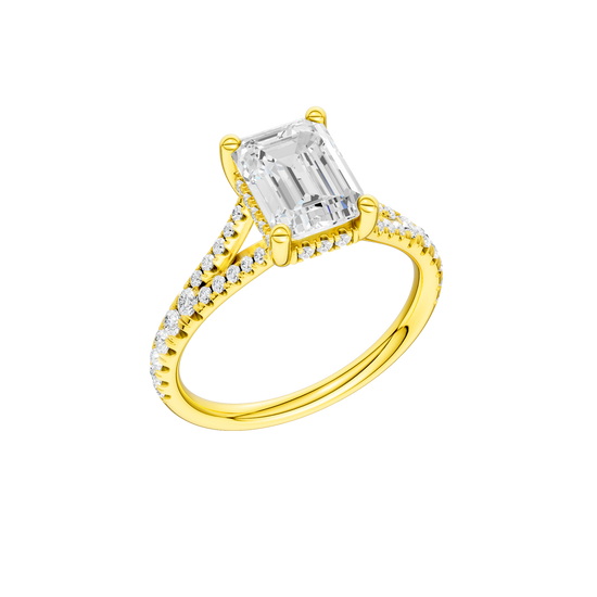 A three-quarter view of the Emerald cut diamond engagement ring in 14k yellow gold with a prong diamond band and hidden halo setting