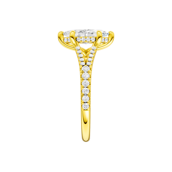 A side view of the Marquise cut diamond engagement ring in 14k yellow gold with a prong band and hidden halo setting