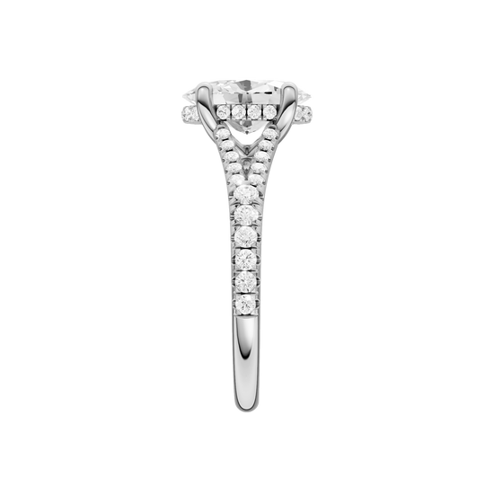 A side view of the Oval cut diamond engagement ring in platinum with a prong band and hidden halo setting