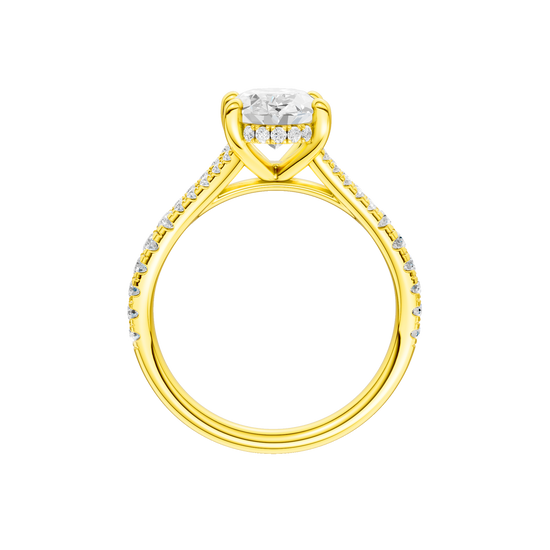 A profile view of the Oval cut diamond engagement ring in 14k yellow gold with a prong band and hidden halo setting