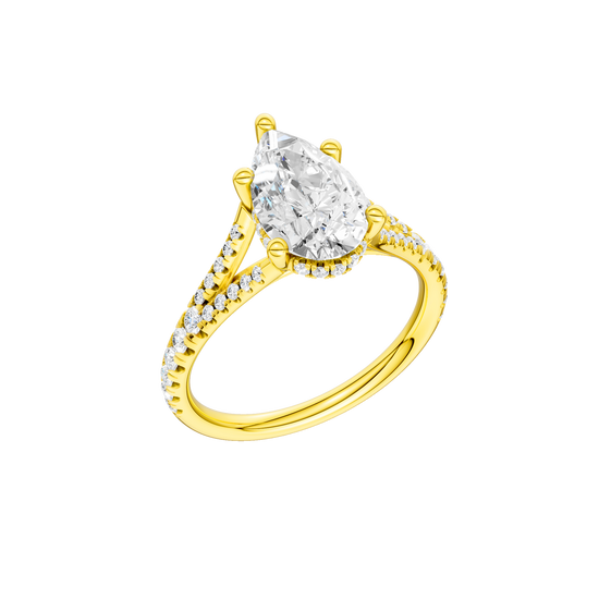 A three-quarter view of the Pear cut diamond engagement ring in 14k yellow gold with a prong band and cathedral setting