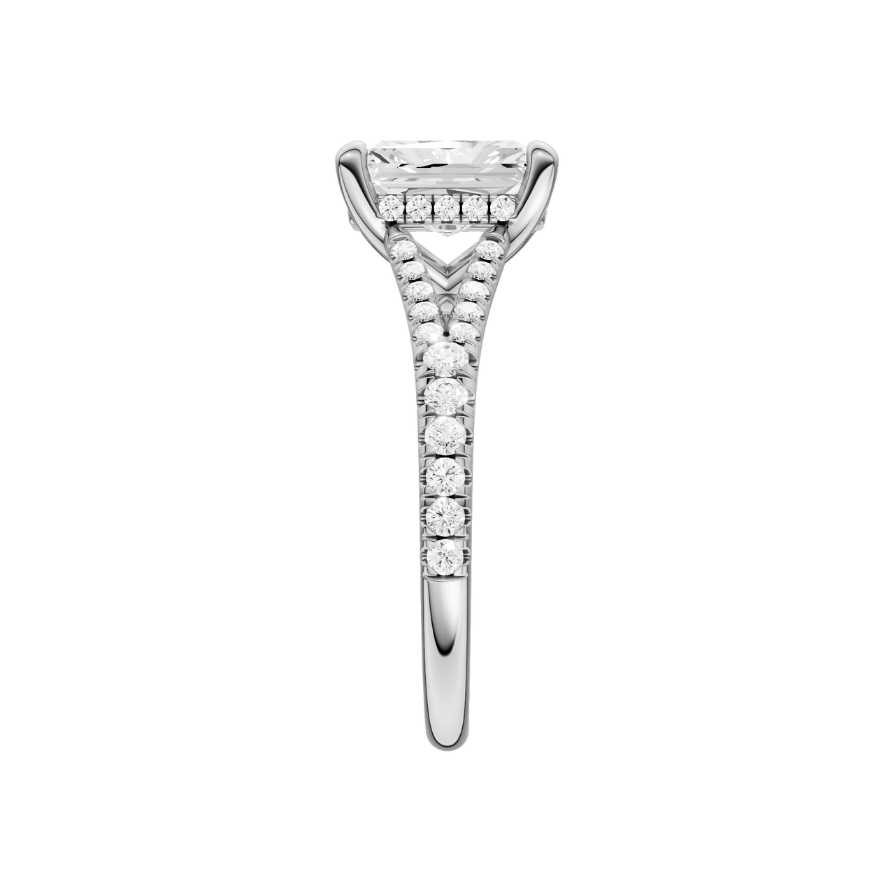 A side view of the Radiant cut diamond engagement ring in platinum with a prong band and hidden halo setting