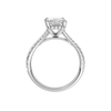 A profile view of the Radiant cut diamond engagement ring in 14k white gold with a prong band and hidden halo setting