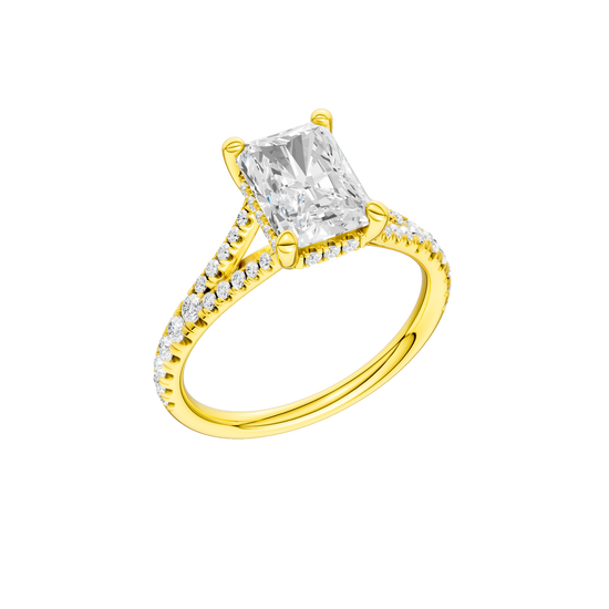 A three-quarter view of the Radiant cut diamond engagement ring in 14k yellow gold with a prong band and hidden halo setting