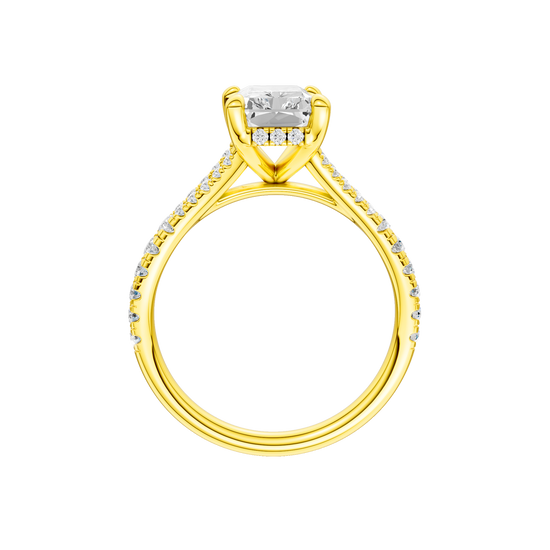 A profile view of the Radiant cut diamond engagement ring in 14k yellow gold with a prong band and hidden halo setting