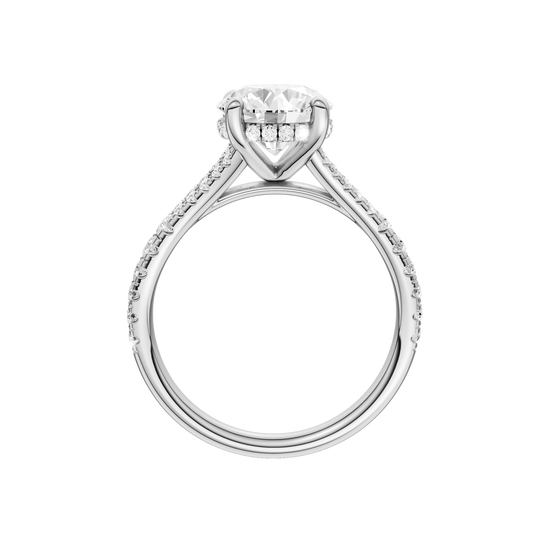 A profile view of the Round cut diamond engagement ring in 14k white gold with a prong band and hidden halo setting