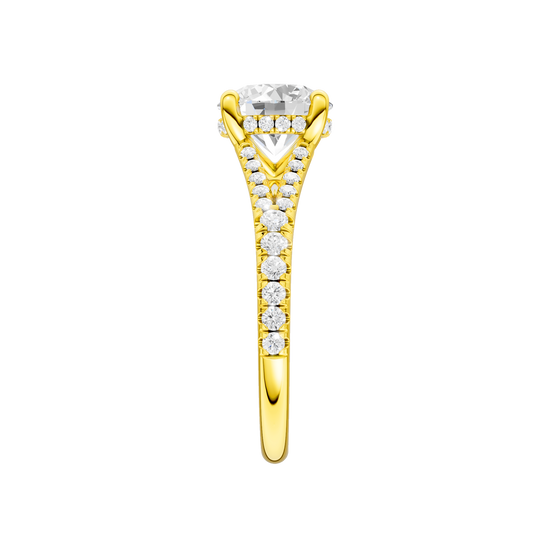 A side view of the Round cut diamond engagement ring in 14k yellow gold with a prong band and hidden halo setting