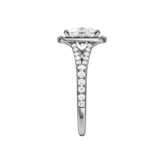 A side view of the Elongated Cushion cut diamond engagement ring in platinum with a prong band and halo setting
