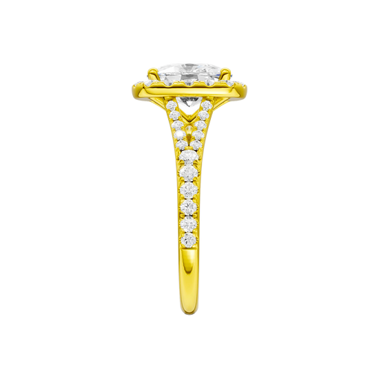 A side view of the Elongated Cushion cut diamond engagement ring in 14k yellow gold with a prong band and halo setting