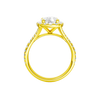 A profile view of the Elongated Cushion cut diamond engagement ring in 14k yellow gold with a prong band and halo setting