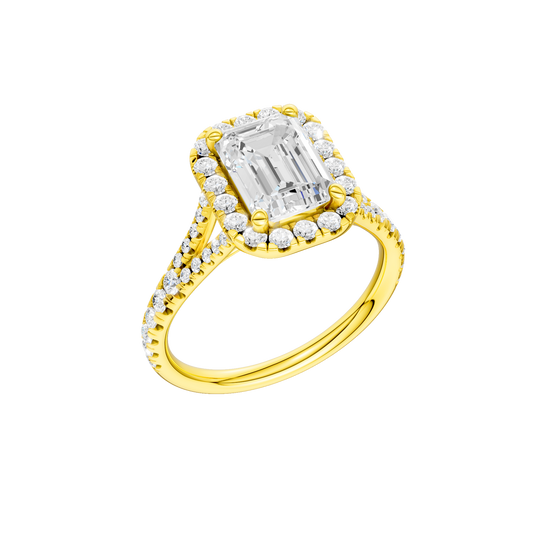 A three-quarter view of the Emerald cut diamond engagement ring in 14k yellow gold with a prong band and solitaire setting