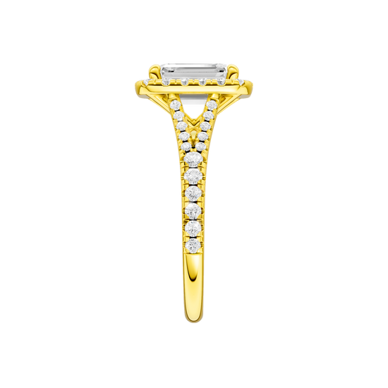 A side view of the Emerald cut diamond engagement ring in 14k yellow gold with a prong band and solitaire setting