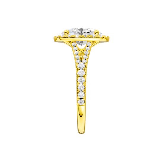 A side view of the Oval cut diamond engagement ring in 14k yellow gold with a prong band and solitaire setting