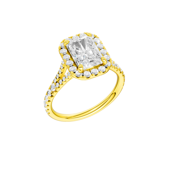A three-quarter view of the Radiant cut diamond engagement ring in 14k yellow gold with a diamond band and halo setting