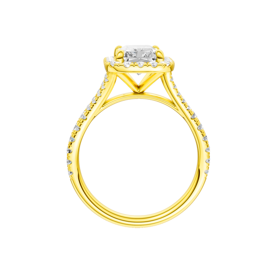 A profile view of the Radiant cut diamond engagement ring in 14k yellow gold with a diamond band and halo setting