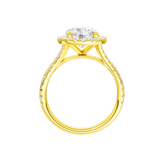 A profile view of the Round cut diamond engagement ring in 14k yellow gold with a prong diamond band and split setting