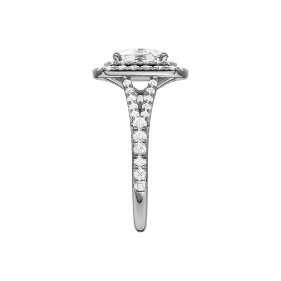 A side view of the Elongated cushion cut diamond engagement ring in platinum with a prong diamond band and split setting