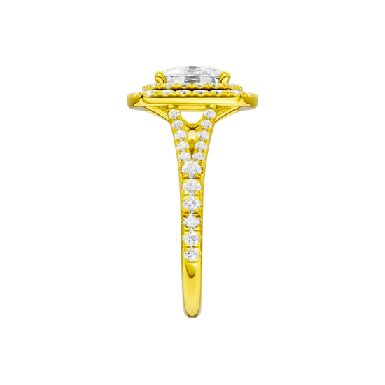 A side view of the Elongated cushion cut diamond engagement ring in 14k yellow gold with a prong diamond band and split setting