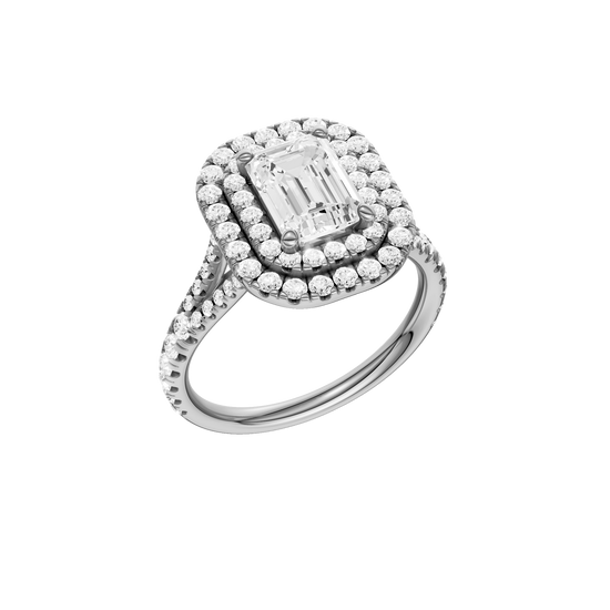 A three-quarter view of the Emerald cut diamond engagement ring in platinum with a prong diamond band and split setting