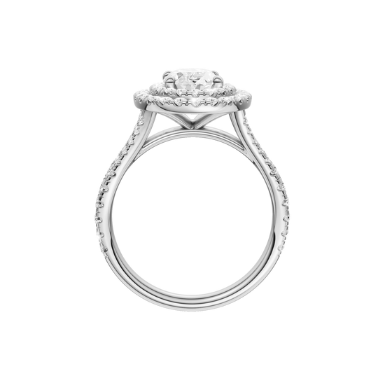 A profile view of the Oval cut diamond engagement ring in platinum with a prong diamond band and split setting