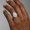 Pear cut diamond engagement ring in 14k white gold with a prong diamond band and split setting on a hand