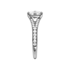 A side view of the Elongated cushion cut diamond engagement ring in platinum with a diamond channel band and split setting