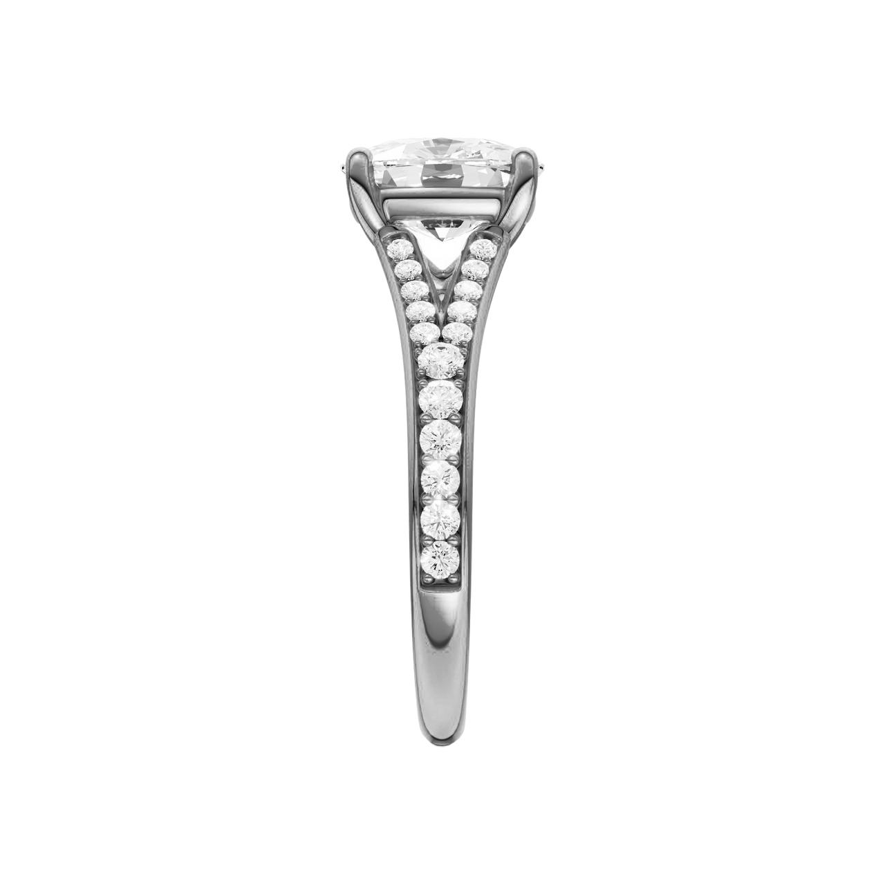 A side view of the Elongated cushion cut diamond engagement ring in platinum with a diamond channel band and split setting