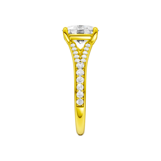 A side view of the Elongated cushion cut diamond engagement ring in 14k yellow gold with a diamond channel band and split setting