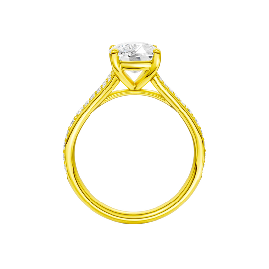 A profile view of the Elongated cushion cut diamond engagement ring in 14k yellow gold with a diamond channel band and split setting