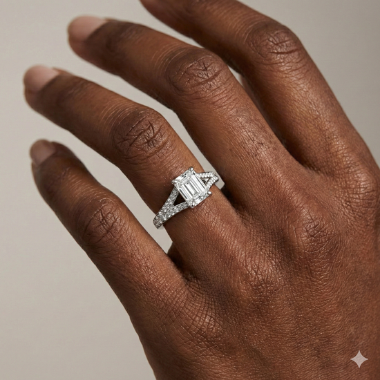 Emerald cut diamond engagement ring in 14k white gold with a diamond channel band and split setting on a hand