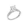A three-quarter view of the Emerald cut diamond engagement ring in 14k white gold with a diamond channel band and split setting