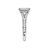 A side view of the Emerald cut diamond engagement ring in 14k white gold with a diamond channel band and split setting