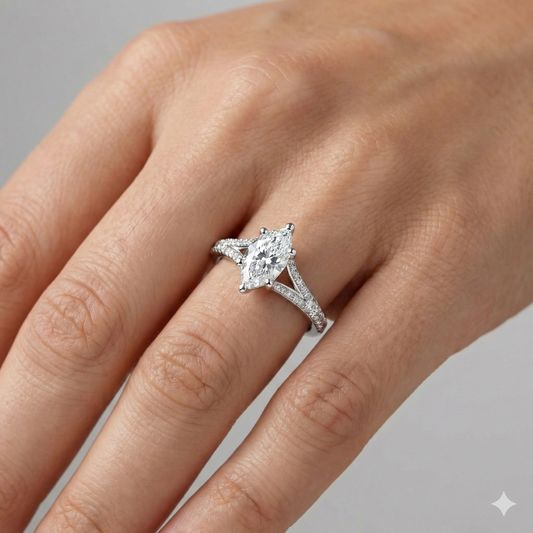 Marquise cut diamond engagement ring in 14k white gold with a diamond channel band and split setting on a hand