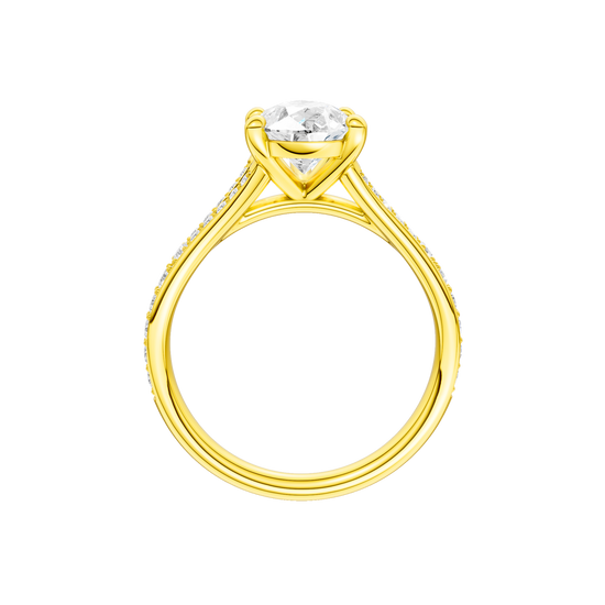 A profile view of the Pear cut diamond engagement ring in 14k yellow gold with a diamond channel band and split setting
