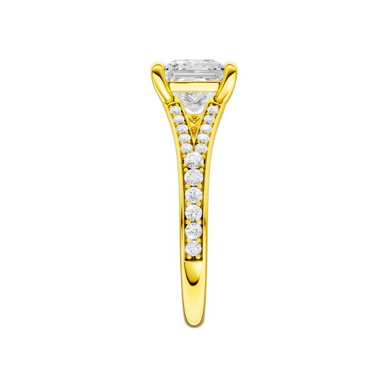 A side view of the Princess cut diamond engagement ring in 14k yellow gold with a diamond channel band and split setting