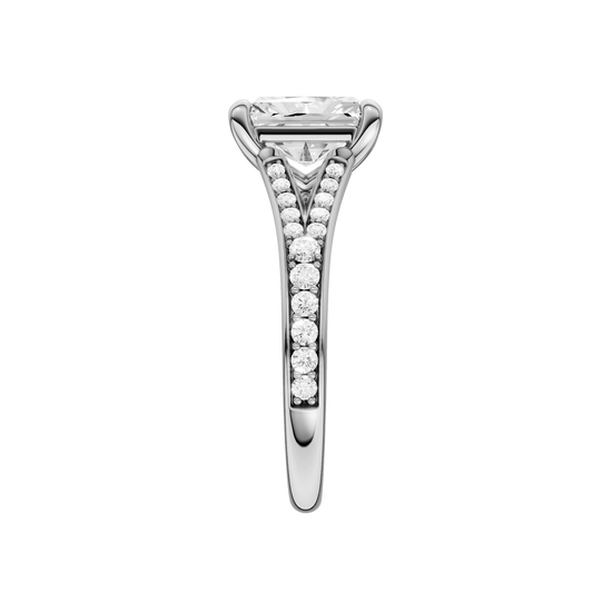 A side view of the Radiant cut diamond engagement ring in platinum with a diamond channel band and split setting